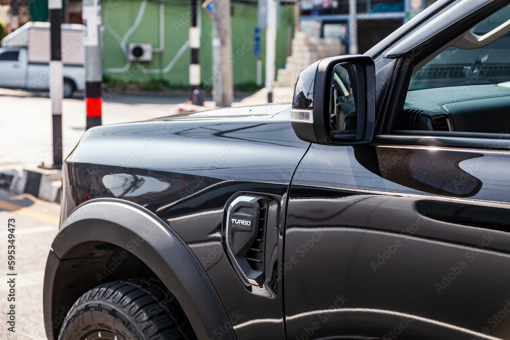 Pickup truck front fender with ventilation grille and turbo lettering