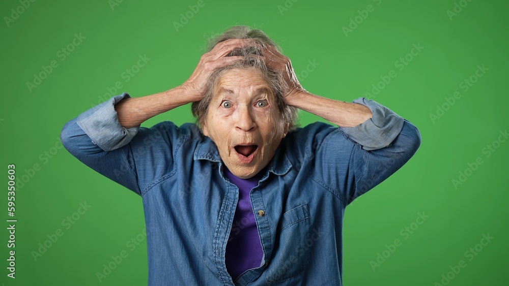 Portrait of excited, surprised saying WOW smiling elderly senior old woman with wrinkled skin and grey hair smiling isolated on green screen background studio Portrait of excited, surprised saying WOW smiling elderly senior old woman with wrinkled skin and grey hair smiling isolated on green screen background studio