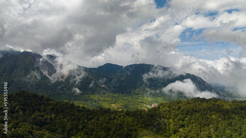 Aerial view of mountains with tropical forest and jungle. Sibayak active volcano. Sumatra, Indonesia.