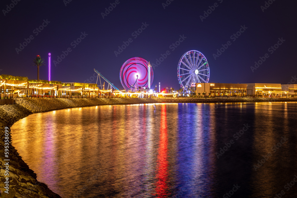 Ferris wheel, Lusail Winter Wonderland outdoor amusement park in Al Maha Island Night View