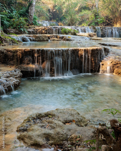 Turquoise water flowing down the Kuan si falls near Luang Prabang - Laos