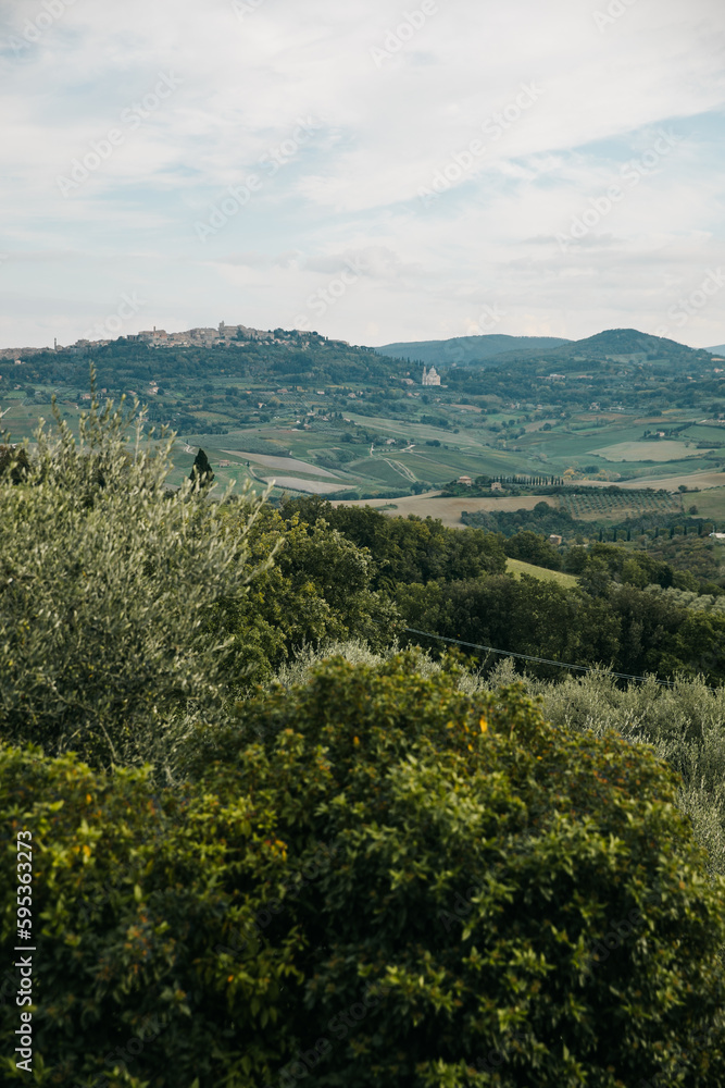 View of Tuscany farmland and mountains on an overcast day in       It