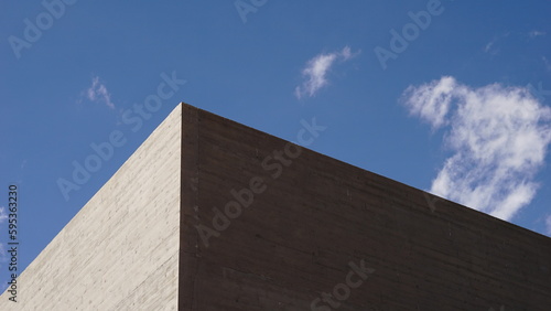 corner of cement facade against sky