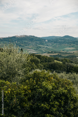 View of Tuscany farmland and mountains on an overcast day in       It