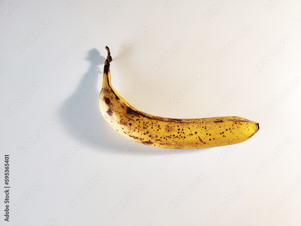 Photo of Overripe Banana on White Background Photo of Overripe Banana on White Background