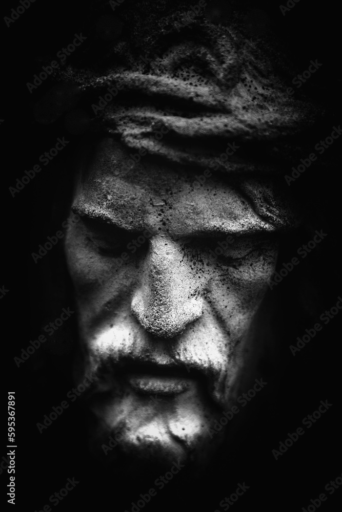 Antique statue of suffering of Jesus Christ crown of thorns. Black and white image. Fragment. Black and white image. Antique statue of suffering of Jesus Christ crown of thorns. Black and white image. Fragment. Black and white image.