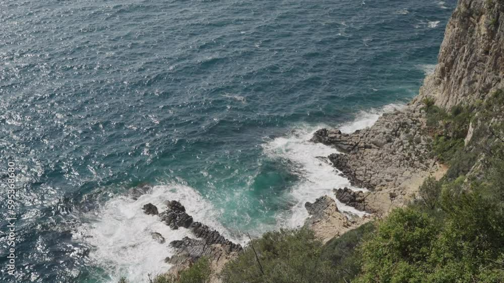 Slow motion Azure waves of mediterranean sea splashing on French Riviera coast Slow motion Azure waves of mediterranean sea splashing on French Riviera coast