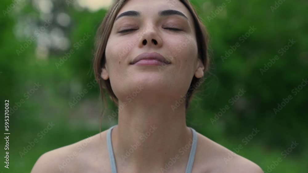 Relaxed woman breathing fresh air outdoors Relaxed woman breathing fresh air outdoors