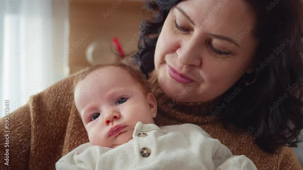 A joyous grandmother shares a loving embrace with a little one holding baby unfant. Family love and affection, warm and cozy atmosphere, happy childhood memories, child care products. A joyous grandmother shares a loving embrace with a little one holding baby unfant. Family love and affection, warm and cozy atmosphere, happy childhood memories, child care products.