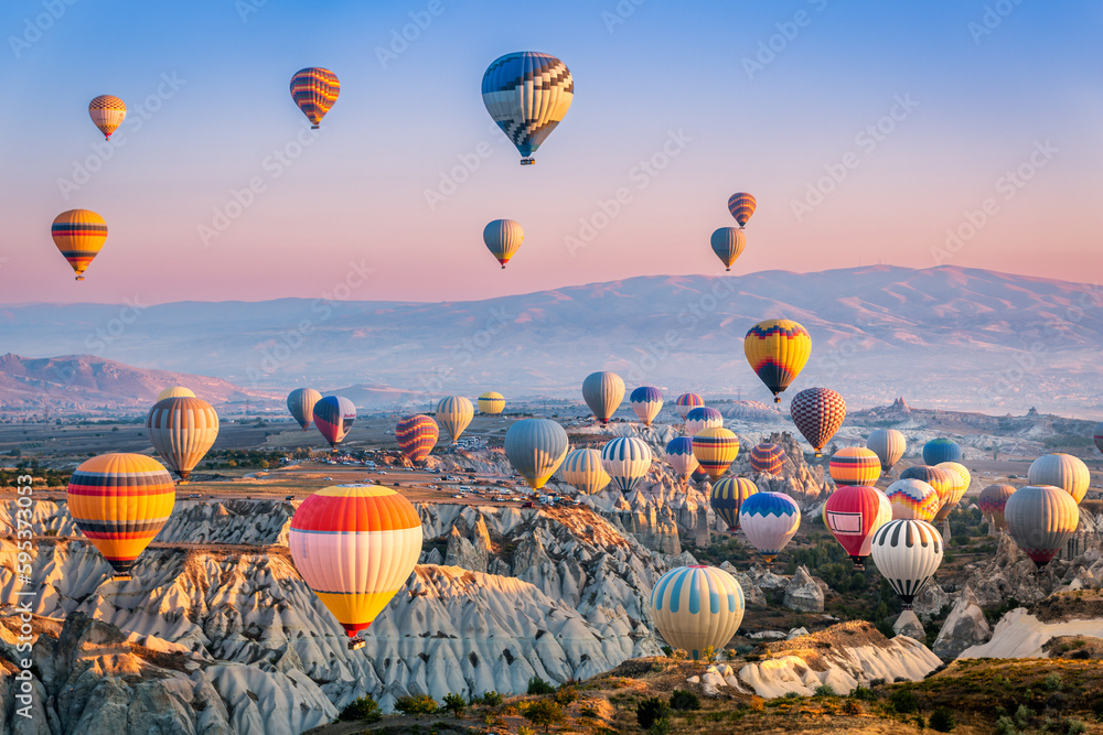 Aerial View Of A Fleet Of Hot Air Balloons In Cappadocia Turkey At Aerial View Of A Fleet Of Hot Air Balloons In Cappadocia Turkey At