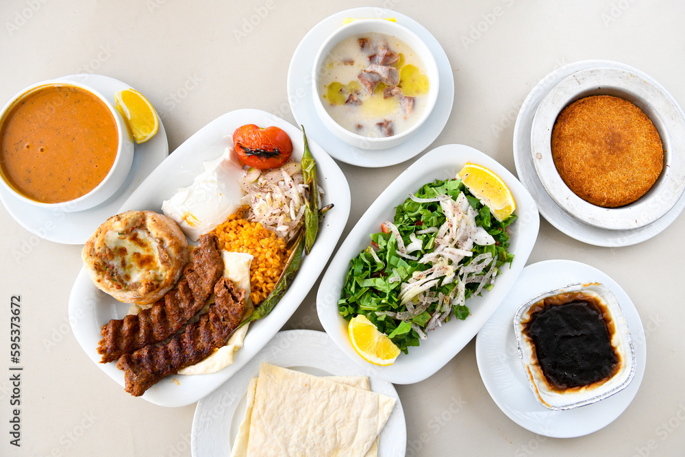 Table scene of assorted take out or delivery foods. Traditional Turkish cuisine. Various Turkish meal and appetizers. Top down view on a table.