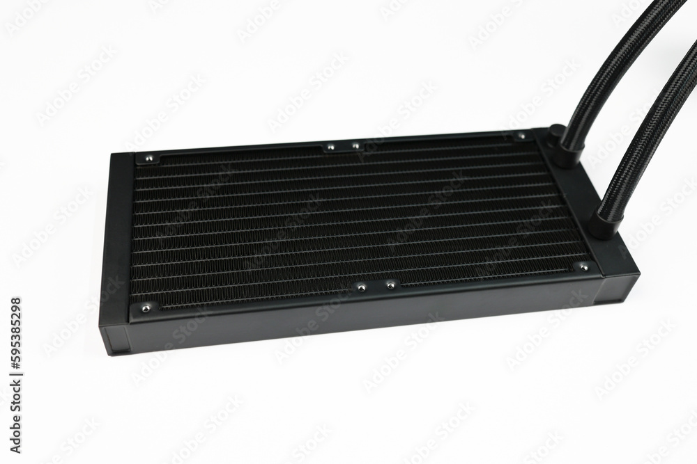 A Black Desktop PC Radiator on a White Background, Side View. This is a Computer Part, used to install a Liquid cooler or AIO Cooler on the CPU. A Black Desktop PC Radiator on a White Background, Side View. This is a Computer Part, used to install a Liquid cooler or AIO Cooler on the CPU.