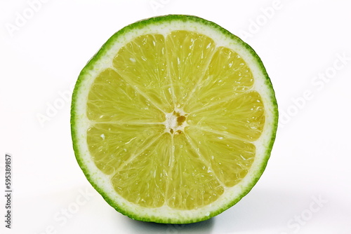 fresh cut lemon lime citrus fruit slice closeup in white background