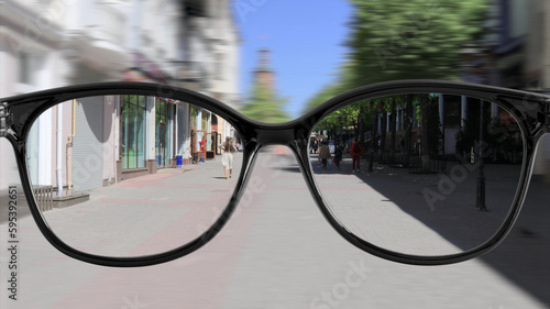 a sharpness with glasses walking around the city.