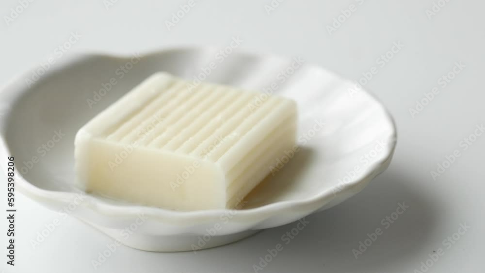 Homemade natural soap bar on black background Homemade natural soap bar on black background