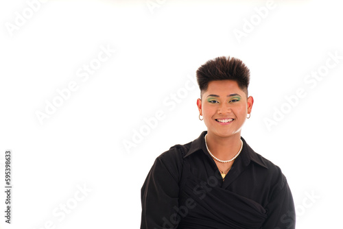 portrait of young gender non binary asian person from front smiling on white background