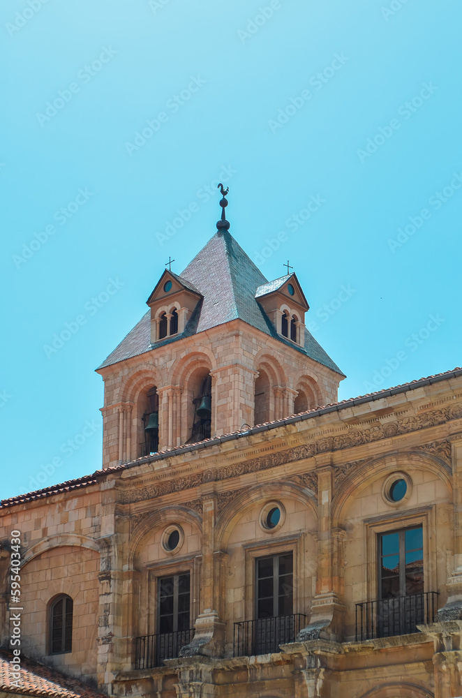 The Romanesque tower with the replica of the original iron rooster on top, of the Basilica of Leon, Spain.