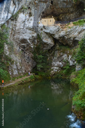 The small lake that lies below the Sanctuary of Covadonga, surrounded by moldy rocks and local flora.