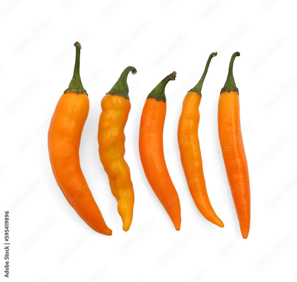 Fresh raw hot chili peppers on white background, flat lay Fresh raw hot chili peppers on white background, flat lay