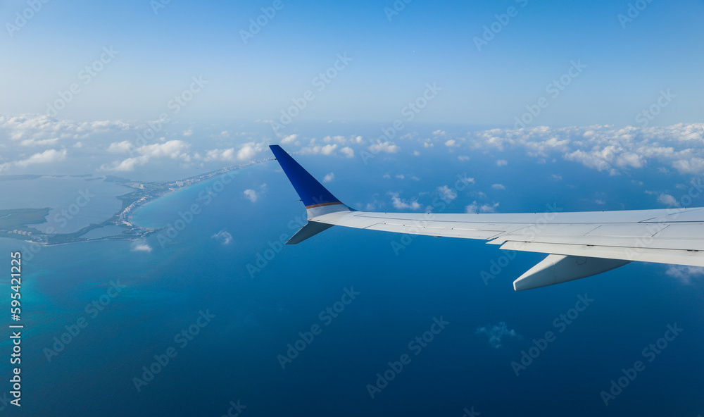 aerial view from a window seat captures the majestic airplane wing soaring through the clouds, symbolizing freedom, adventure, and travel. The view offers a sense of perspective aerial view from a window seat captures the majestic airplane wing soaring through the clouds, symbolizing freedom, adventure, and travel. The view offers a sense of perspective