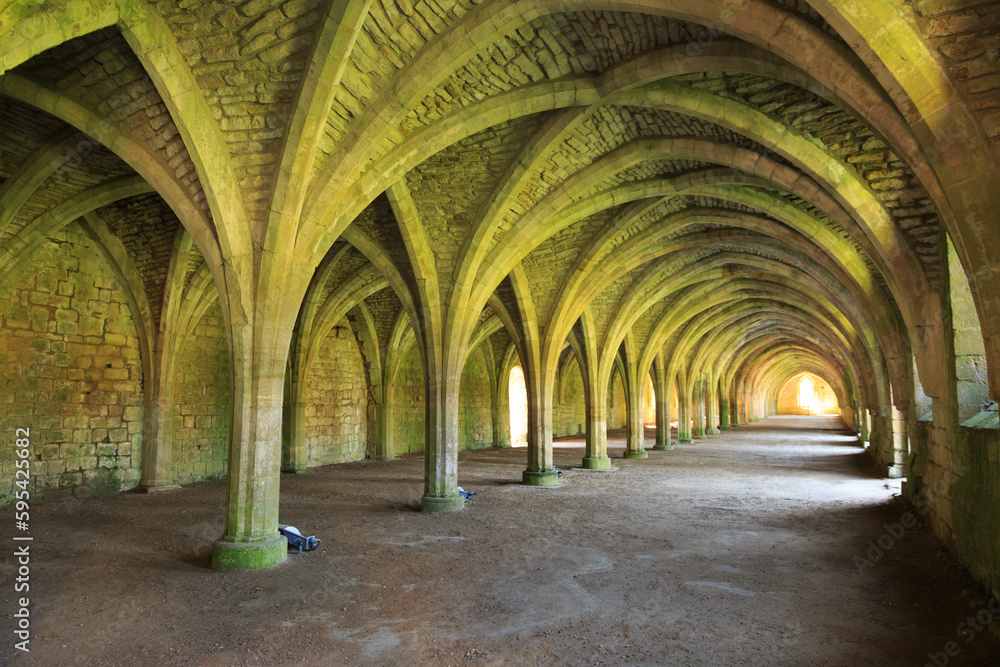 England, North Yorkshire, Ripon. Fountains Abbey, Studley Royal. UNESCO World Heritage Site. Cistercian Monastery. Ruins of vaulted cellarium where food was stored. 2017-05-03 England, North Yorkshire, Ripon. Fountains Abbey, Studley Royal. UNESCO World Heritage Site. Cistercian Monastery. Ruins of vaulted cellarium where food was stored. 2017-05-03