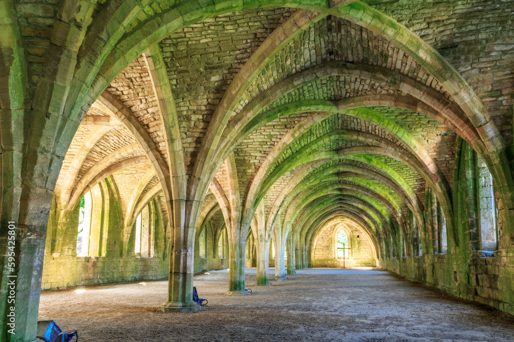 England, North Yorkshire, Ripon. Fountains Abbey, Studley Royal. UNESCO World Heritage Site. Cistercian Monastery. Ruins of vaulted cellarium where food was stored. 2017-05-03 - obrazy, fototapety, plakaty 