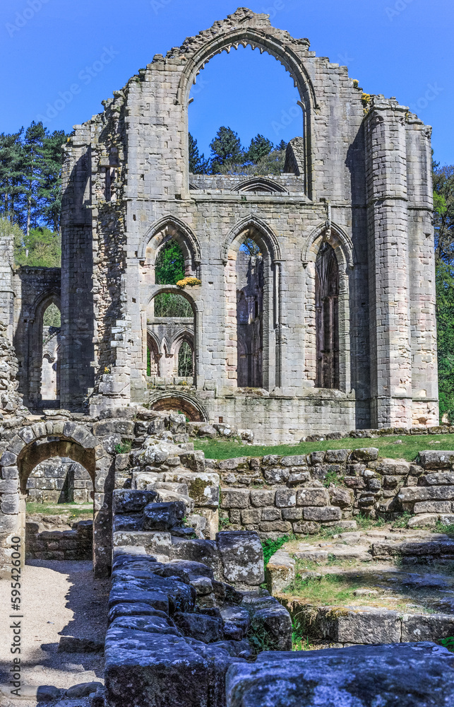 England, North Yorkshire, Ripon. Fountains Abbey, Studley Royal. UNESCO World Heritage Site. National Trust, Cistercian Monastery. Ruins of Abbey church and Tower.