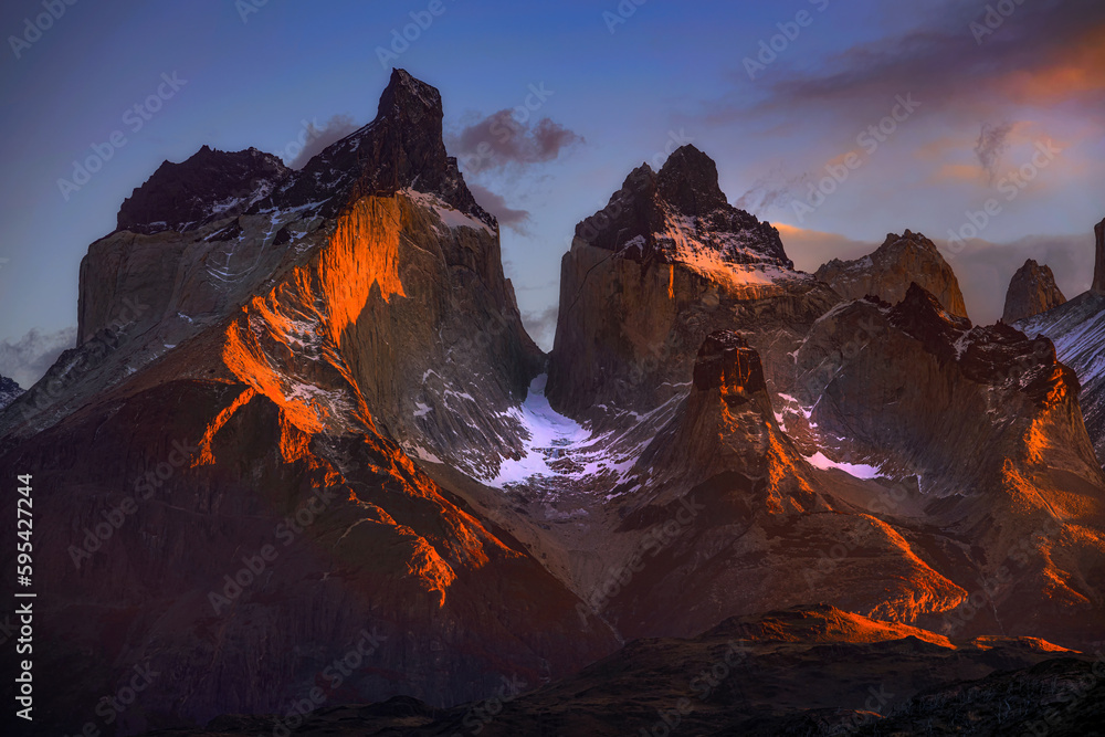 Beautiful scenery of Los Cuernos del Paine mountain peaks in autumn time during sunrise in Patagonia, southern Chile.