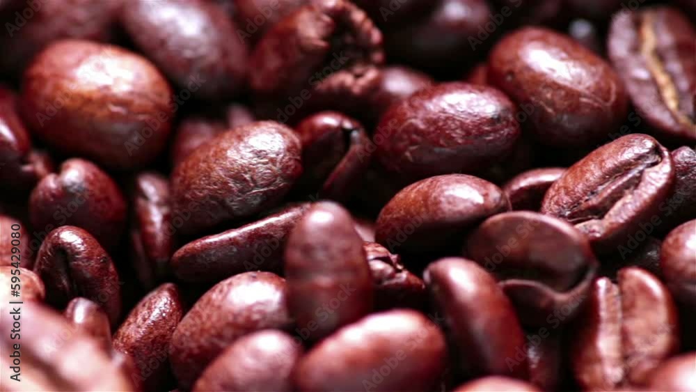 Coffee beans falling out of a roaster, macro sliding dolly motion Coffee beans falling out of a roaster, macro sliding dolly motion