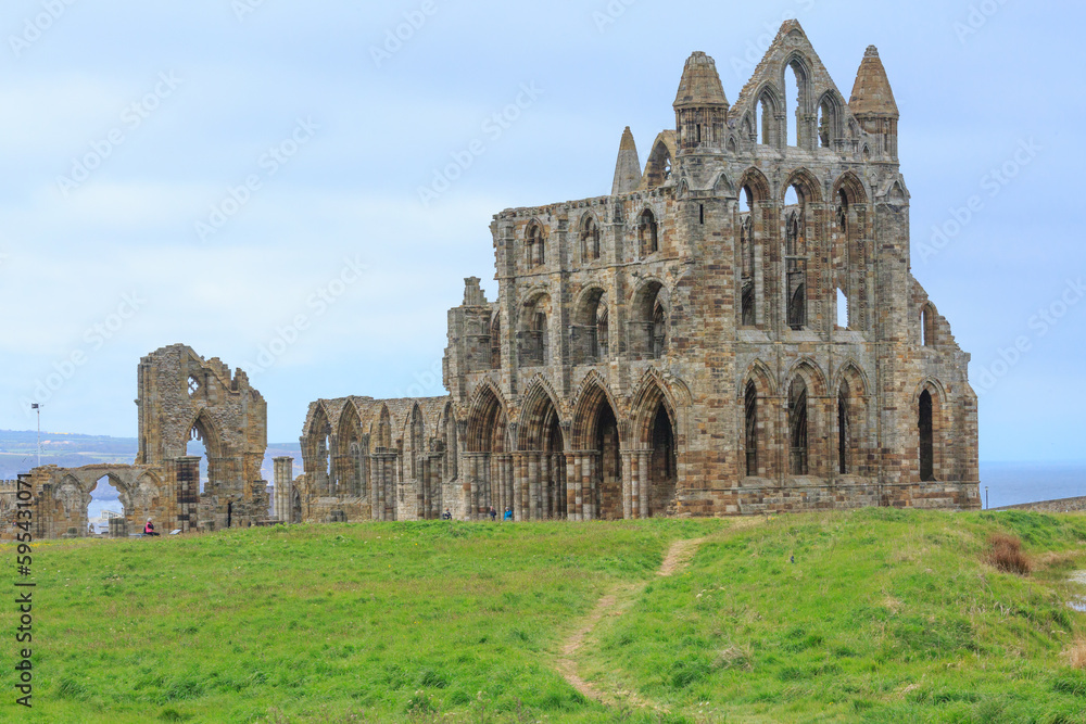 England, North Yorkshire, Whitby. North Sea, East cliff. English Heritage site, ruins of Benedictine abbey, Whitby Abbey, monastery. Inspiration for  Bram Stoker's gothic tale Dracula.
