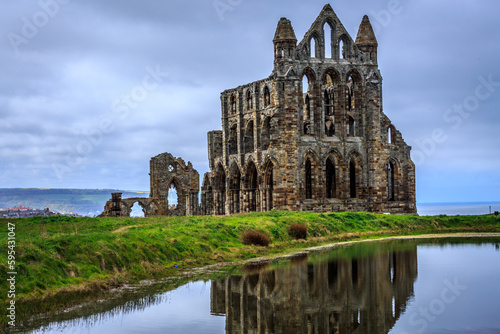 England, North Yorkshire, Whitby. North Sea, East cliff. English Heritage site, ruins of Benedictine abbey, Whitby Abbey, monastery. Inspiration for Bram Stoker's gothic tale Dracula.