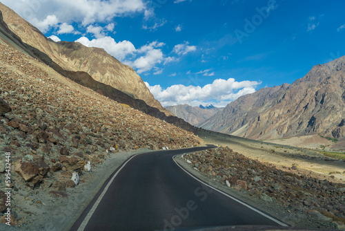 beautiful photo of the road going through the mountains and blue sky at Turtuk village, Nubra Valley, Ladakh, India. © Nhan