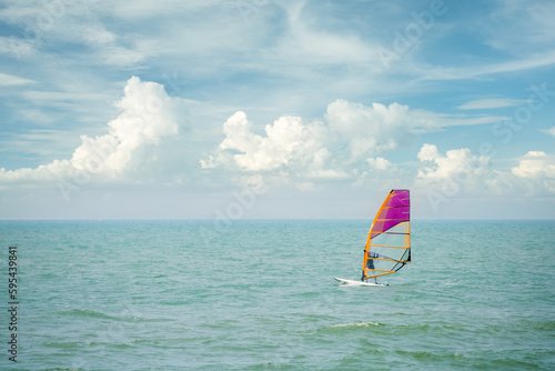 Windsurfing sails on the blue sea. Active lifestyle. Summer water fun. Hobby.