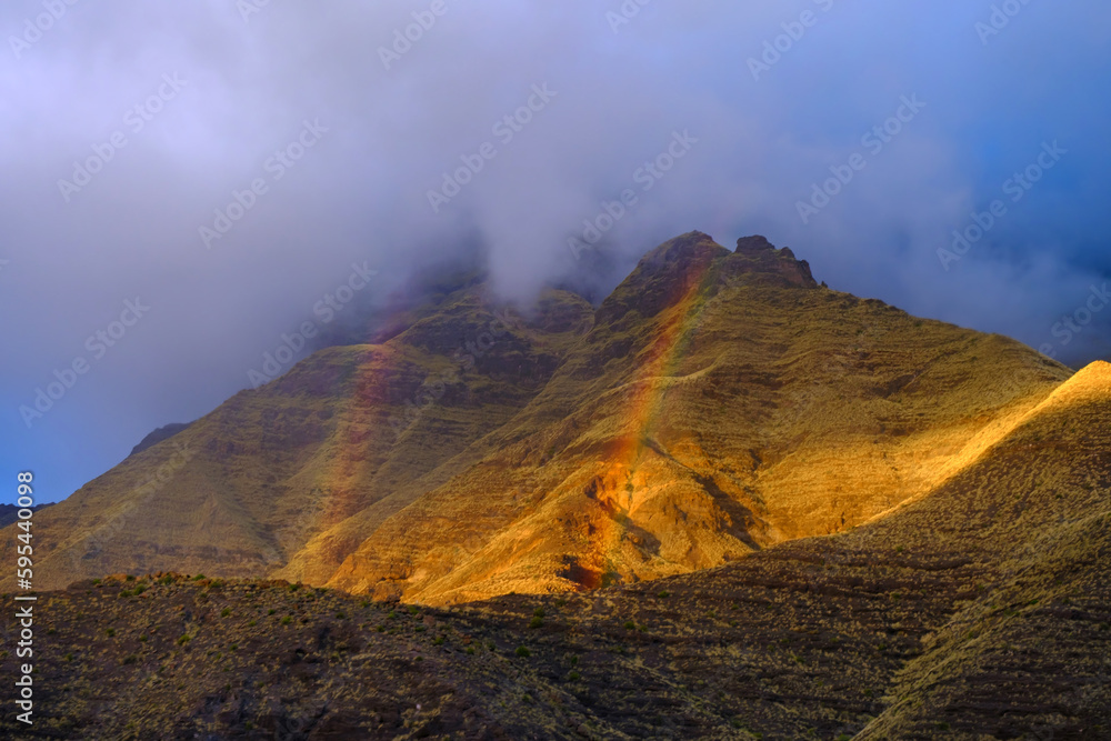 Rainbow in the mountains of the natural park Tamadaba on Gran Canaria - Canary Islands, Spain.
