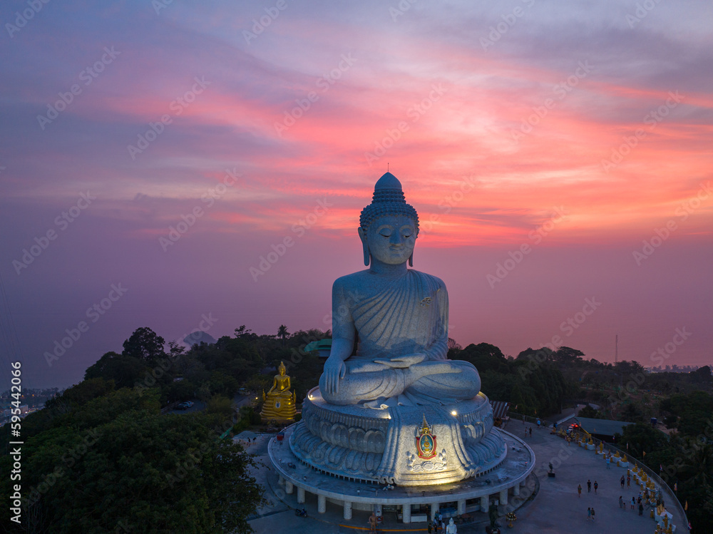 .aerial view Phuket big Buddha in beautiful sunset..aerial photography scenery light through sky in sunset at Phuket big Buddha. .Phuket Big Buddha is one of the island most important and revered .aerial view Phuket big Buddha in beautiful sunset..aerial photography scenery light through sky in sunset at Phuket big Buddha. .Phuket Big Buddha is one of the island most important and revered