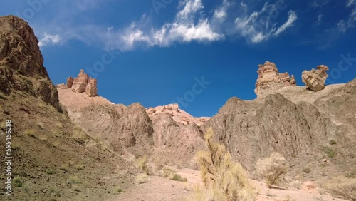Charyn canyon, clouds float over the rocks, bright blue sky, Kazakhstan photo