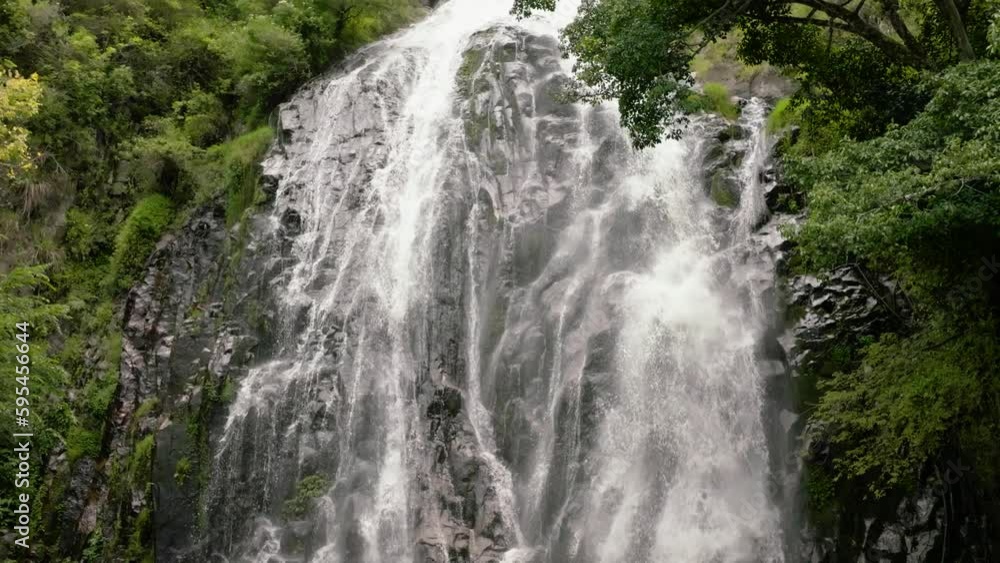 Waterfall in the green forest in slow motion. Efrata Falls. Sumatra, Indonesia. Waterfall in the green forest in slow motion. Efrata Falls. Sumatra, Indonesia.