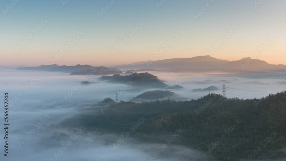 Hyper lapse video 4k motion, Aerial view Beautiful of morning scenery Golden light sunrise And the mist flows on high mountains. Pang Puai, Mae Moh, Lampang, Thailand. Hyper lapse video 4k motion, Aerial view Beautiful of morning scenery Golden light sunrise And the mist flows on high mountains. Pang Puai, Mae Moh, Lampang, Thailand.