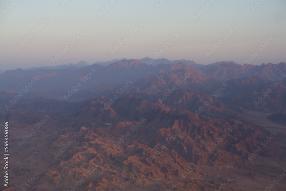 Aerial view from window plane of  mountains in Egypt.