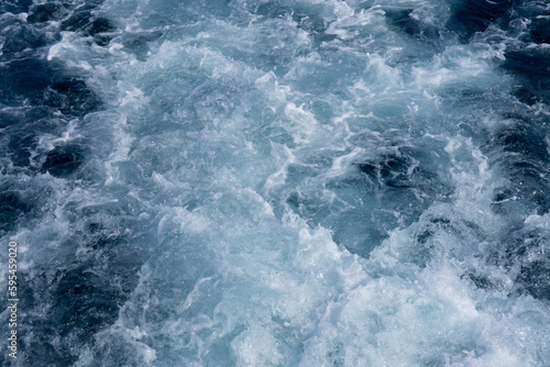 Background shot of aqua sea water surface. Red sea. Blue ocean water texture background. Surface of the sea.