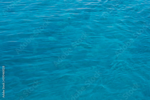 Background shot of aqua sea water surface. Red sea. Blue ocean water texture background. Surface of the sea.