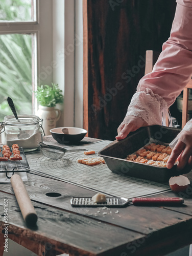 the making process of kaastangel, cheesy cookies. one of favourite cookies in lebaran or ied al fitr or islamic festive or celebration. made with edam and parmesan cheese photo