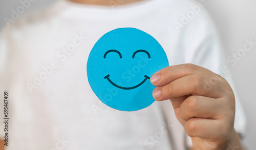 Child kid hand hold paper cut circle face different emotion, emotions, happy, relax, satisfaction survey, customer services, positive, good, wellness, health child, hospital, world mental health day
