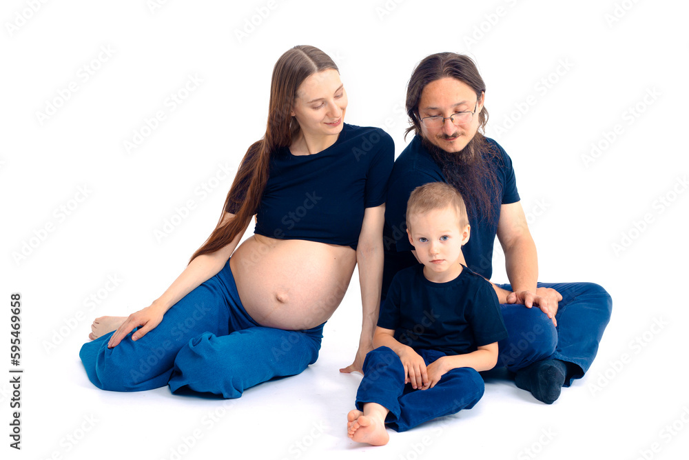beautiful european happy family with a pregnant mother, the father and a son together. High quality photo beautiful european happy family with a pregnant mother, the father and a son together. High quality photo