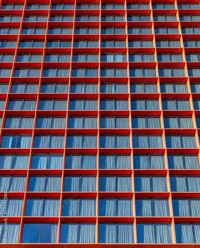 Obraz premium Red windows with blue curtains