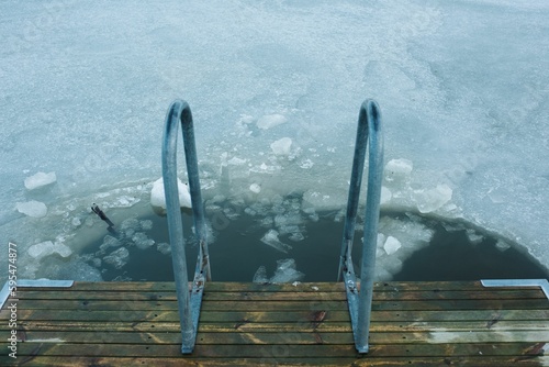 Photography cold water swimming spot in the frozen Baltic Sea in Scandinavia