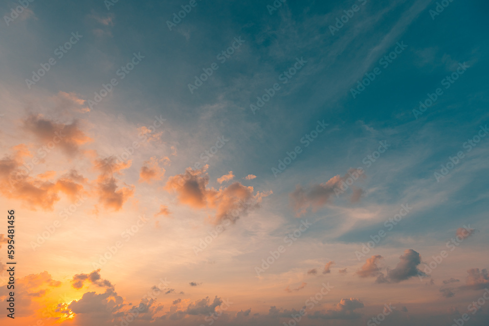Beautiful sunset sky above clouds with dramatic light. Beautiful sunset sky. Nature sky backgrounds, majestic sunrise sundown sky background with gentle colorful clouds