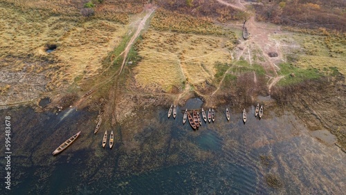 arial drone view of wooden boats moving in chilika lake in deep water photo