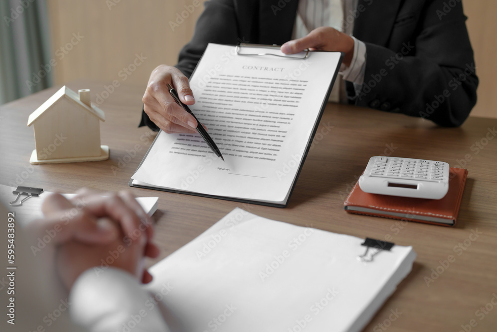 Property investment concept. Real estate broker with home insurance policy about house contract.. Property investment concept. Real estate broker with home insurance policy about house contract..