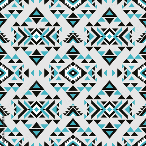 Aztec style blue seamless geometry pattern with tribal ornament. Ornamental ethnic background collection. Use for fabric prints, surface textures, cloth design, wrapping.  photo